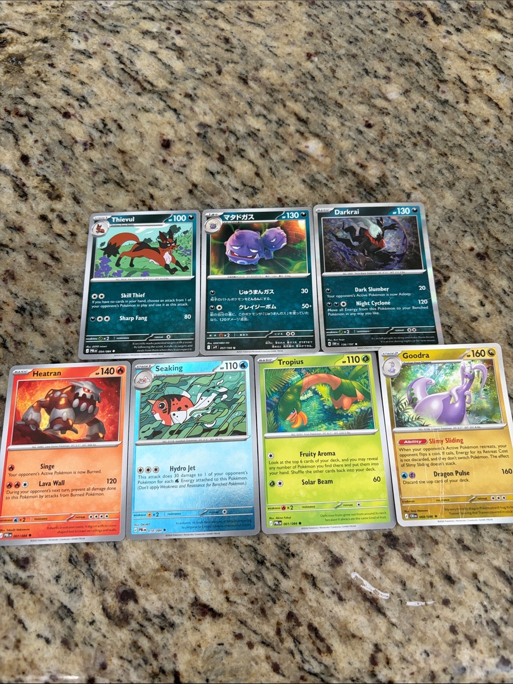Pokemon Trading Cards Lot with Green, Blue, Red, Yellow and Purple Accents